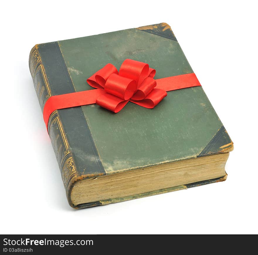 Book old vintage packed as gift with red bow. Book old vintage packed as gift with red bow