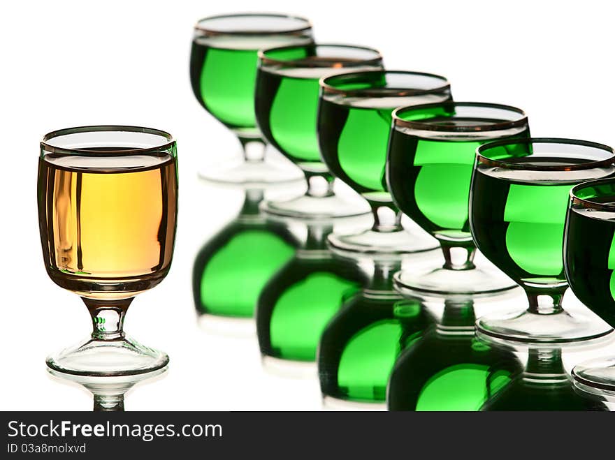 Glasses with alcohol. White background. Studio shot.