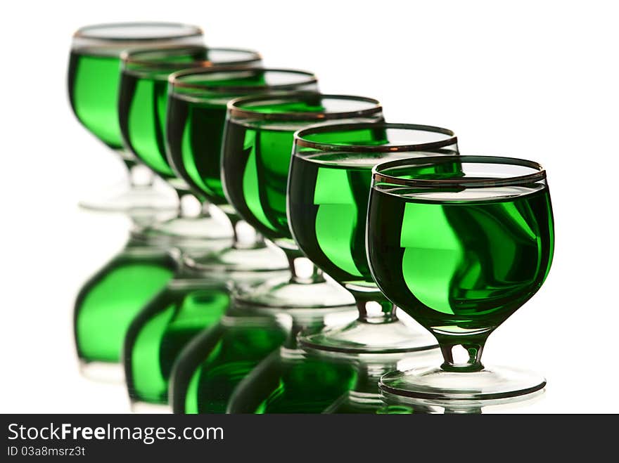 Glasses with alcohol. White background. Studio shot.