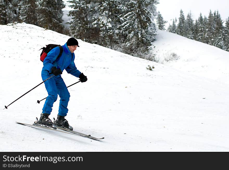 Skier man in snow-covered mountains. Skier man in snow-covered mountains