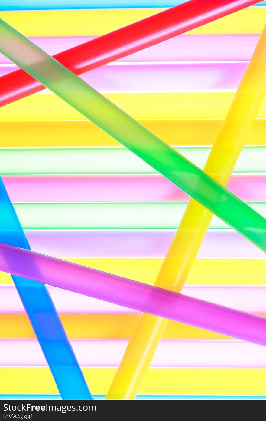 Colorful drinking straws close up background