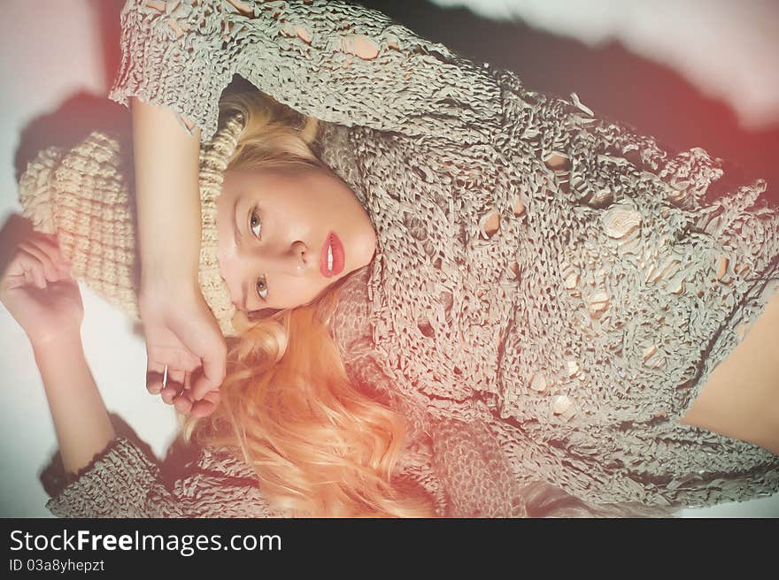 The blonde girl on a gray background