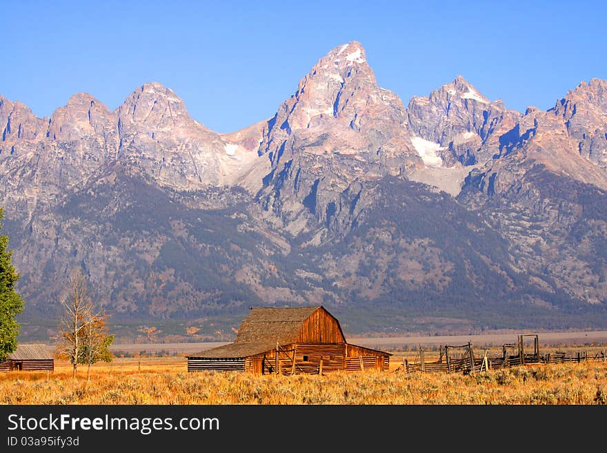 Historic moulton barn in front of Grand Tetons mountain range