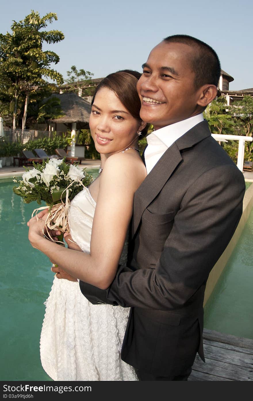 Asian Wedding Couple In Tropical Location