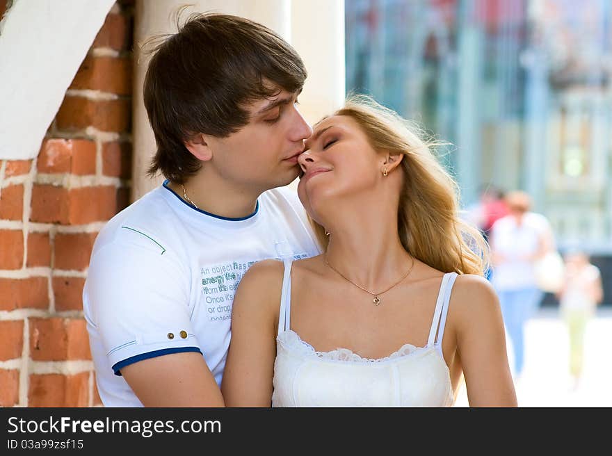 Under the arches of brick picture boy kissing a girl with long blond hair. Under the arches of brick picture boy kissing a girl with long blond hair