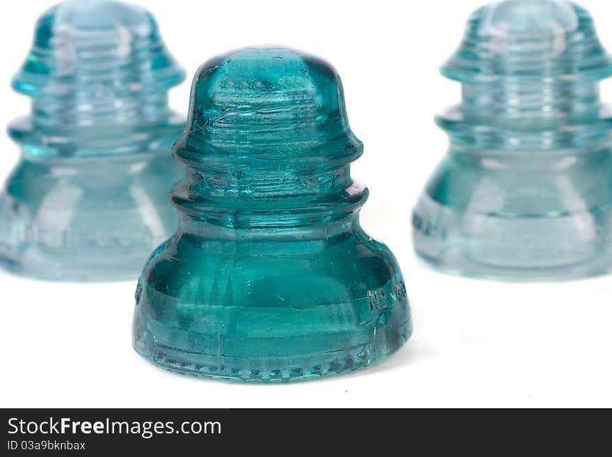 Old glass telephone insulator. Shot against white background. Old glass telephone insulator. Shot against white background.