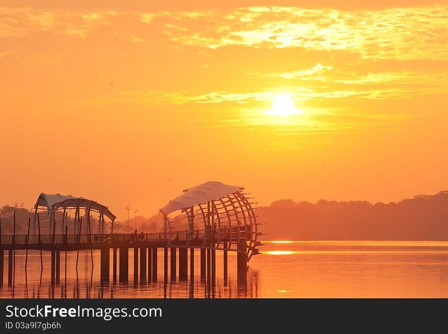 Bold Sunrise behind a pier