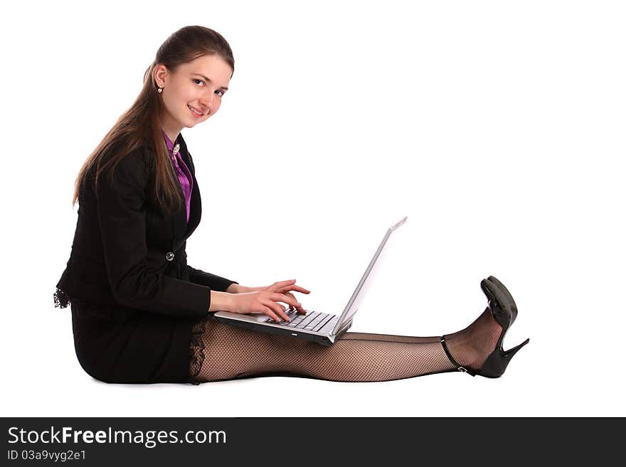 Girl Sits On Floor And Works With Notebook.