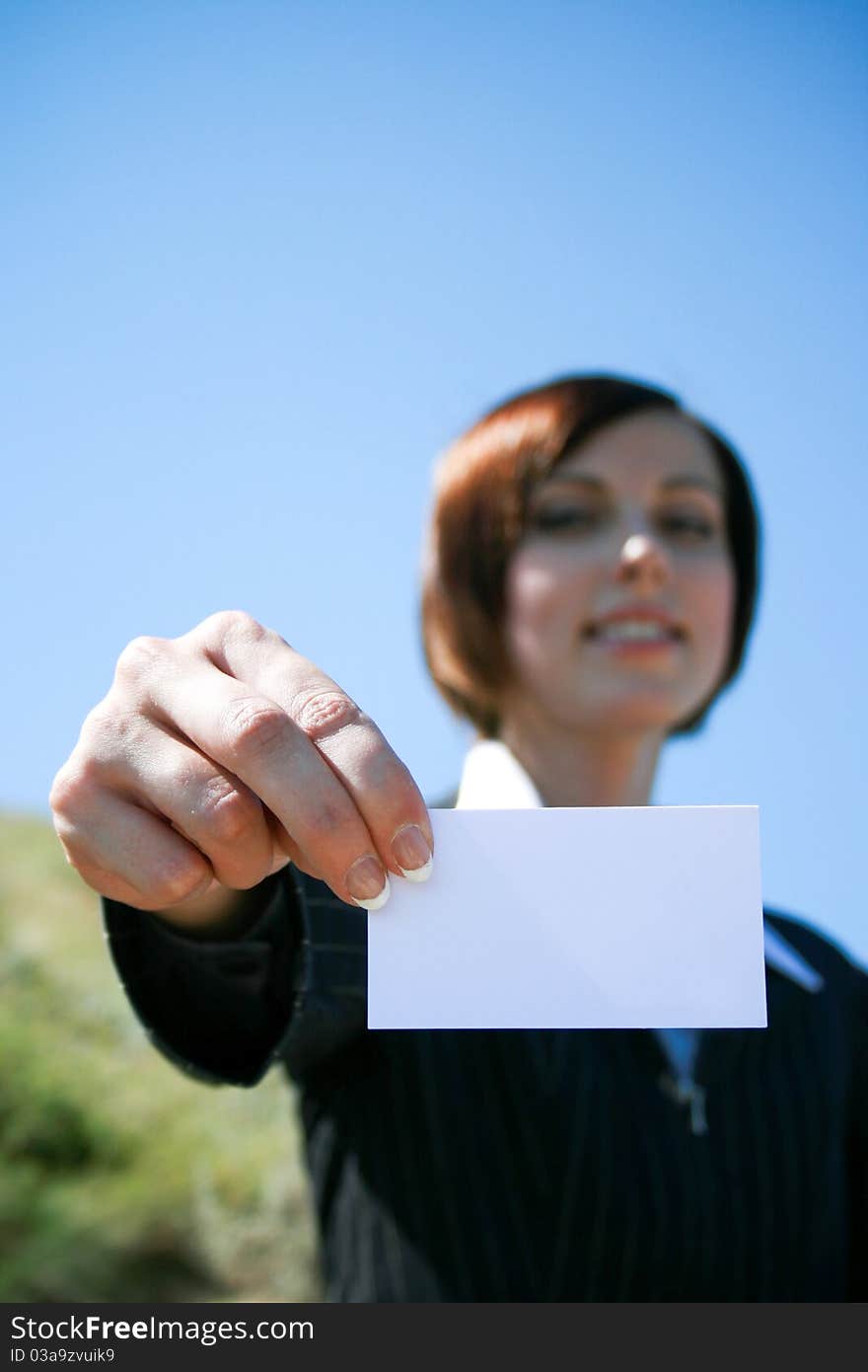 Young caucasian business lady with sheet of paper