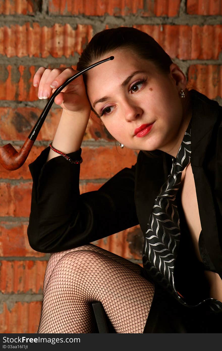 Girl In Black Suit With Tobaco-pipe.