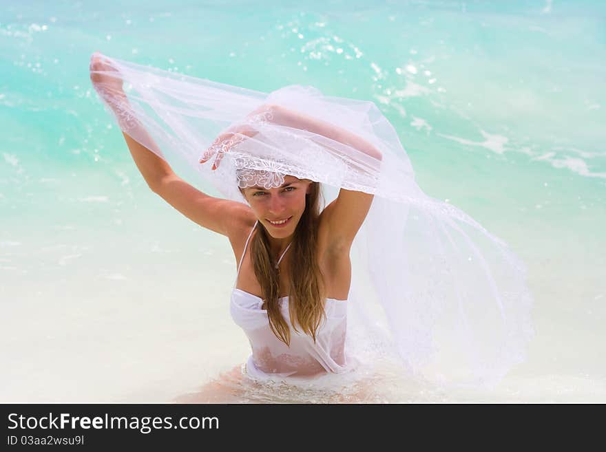 Bride on a coastline at tropical beach. Bride on a coastline at tropical beach