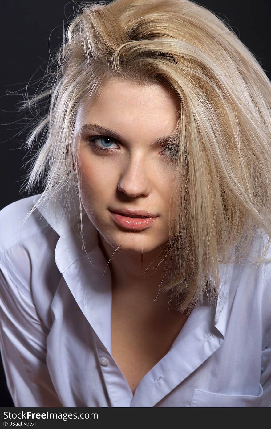 Fashion portrait of sensual blond in man's shirt