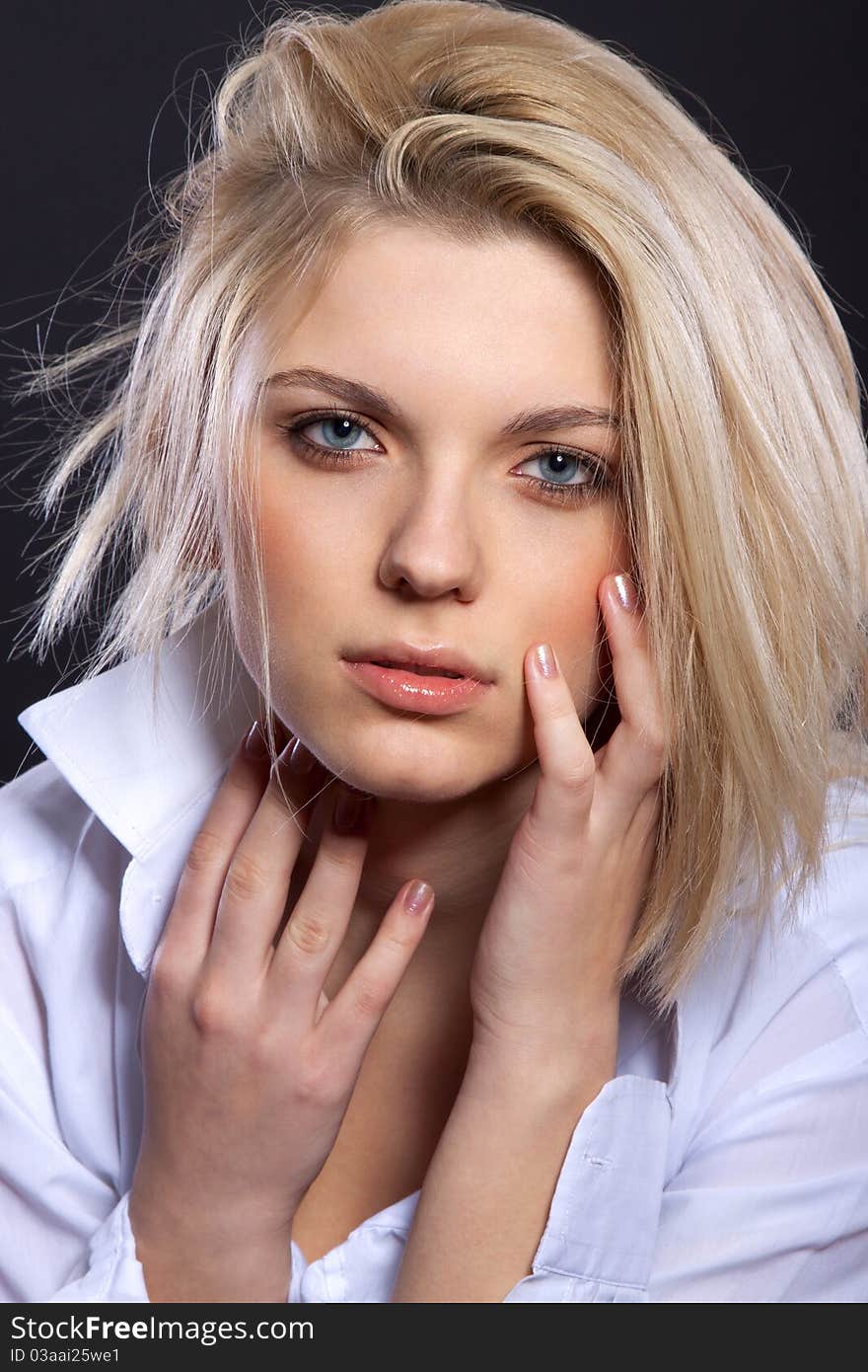 Fashion portrait of sensual blond in man's shirt