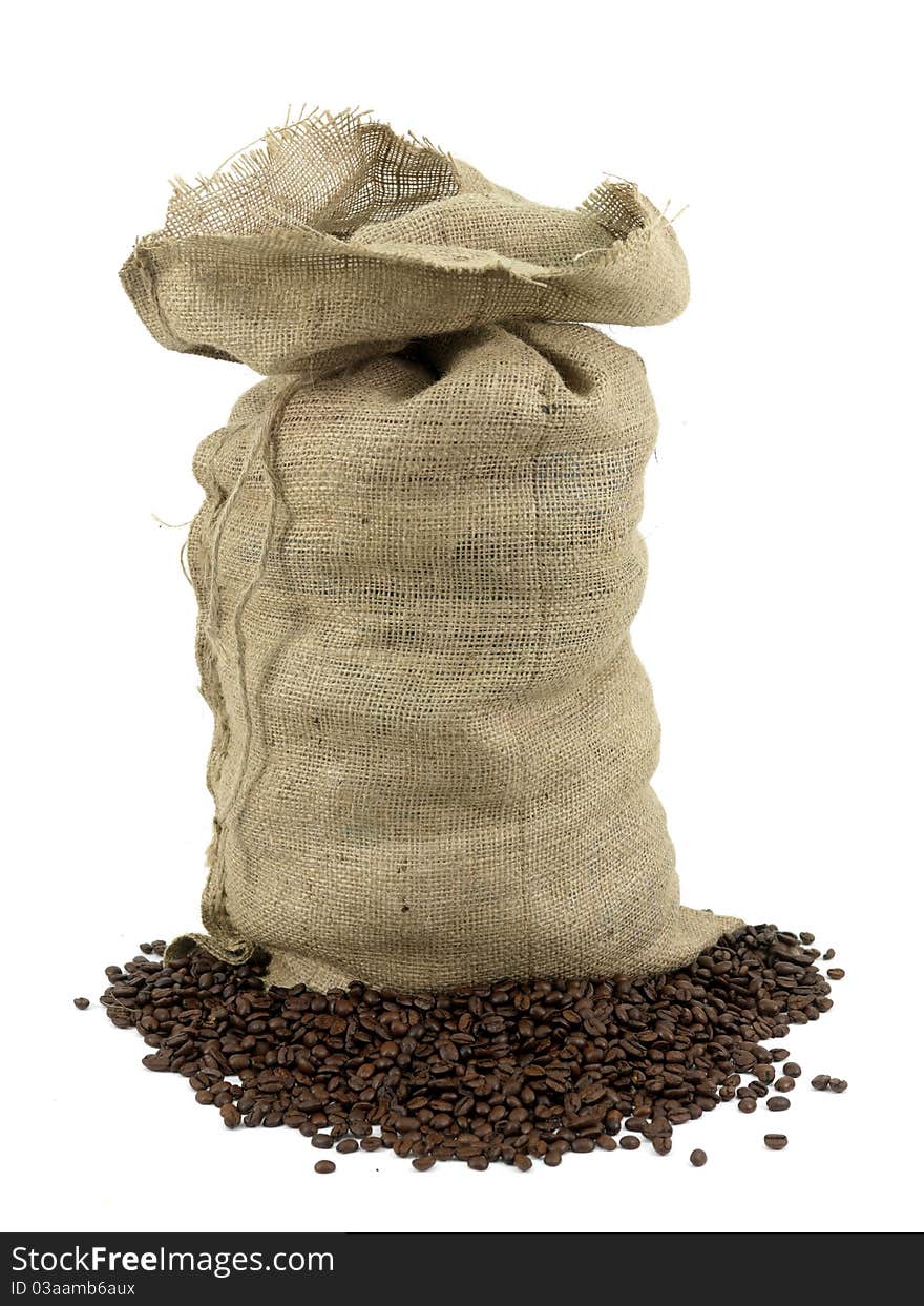 Coffee beans around a hessian bag isolated on white