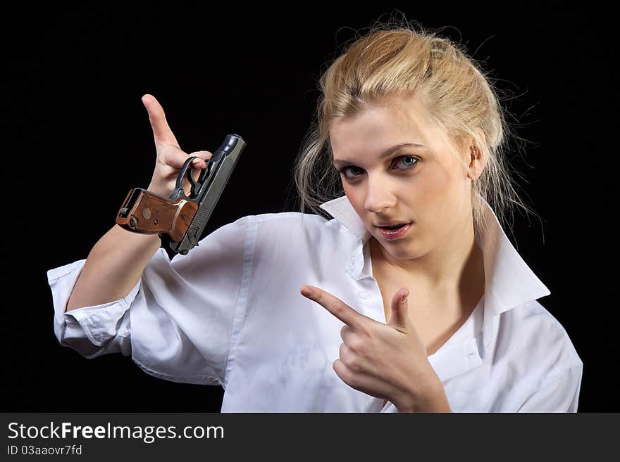 Beautiful girl holding gun, Isolated on black background. Beautiful girl holding gun, Isolated on black background