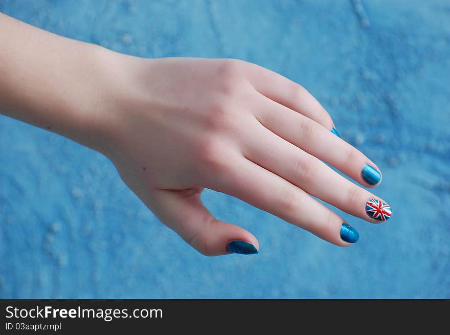 Hand with manicure in British Flag stile. Hand with manicure in British Flag stile