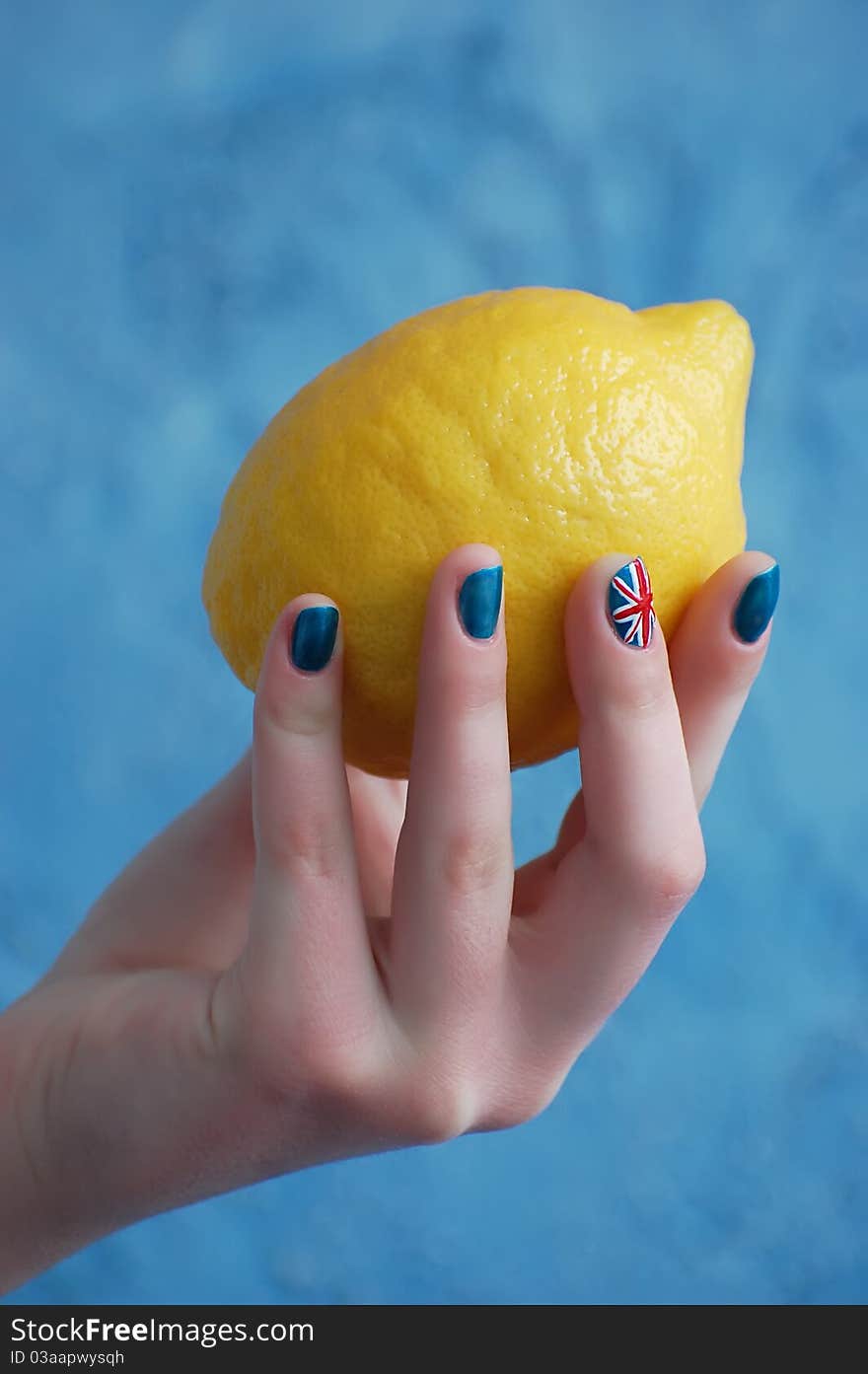 Hand with manicure in British Flag stile. Hand with manicure in British Flag stile