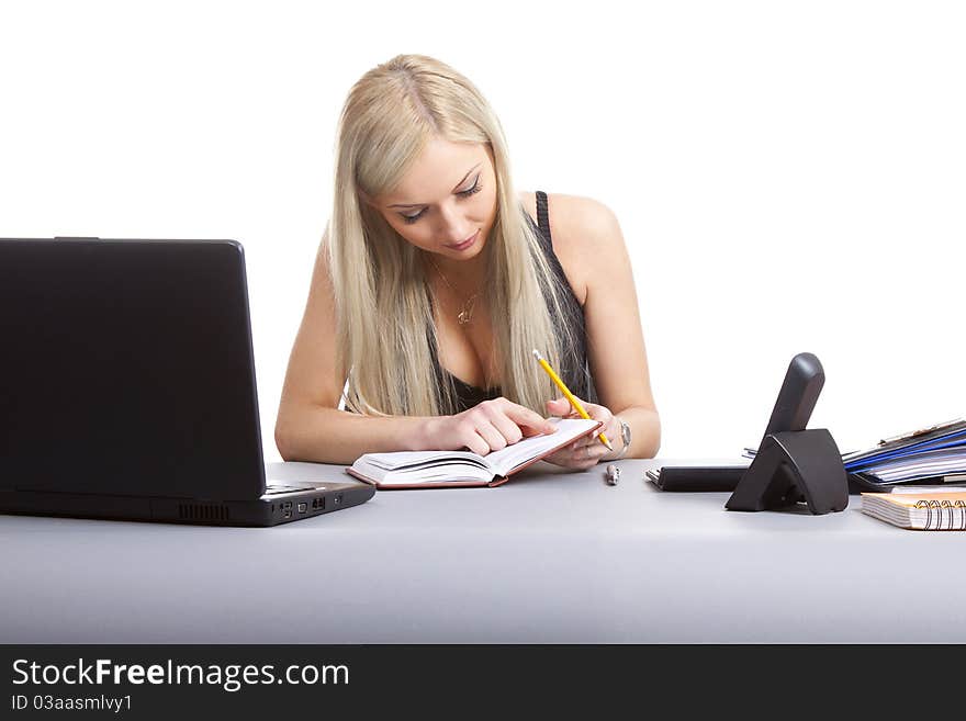 Happy businesswoman sitting at office desk. Isolated on white background. Happy businesswoman sitting at office desk. Isolated on white background.