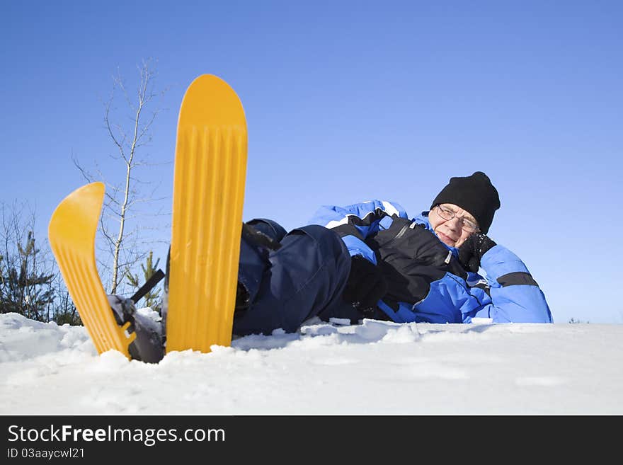 Middle-aged Man Lying In Snow