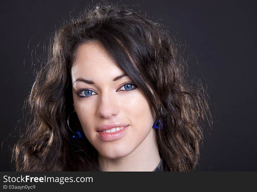 Black hair young caucasian charming woman portrait, studio shot. Black hair young caucasian charming woman portrait, studio shot