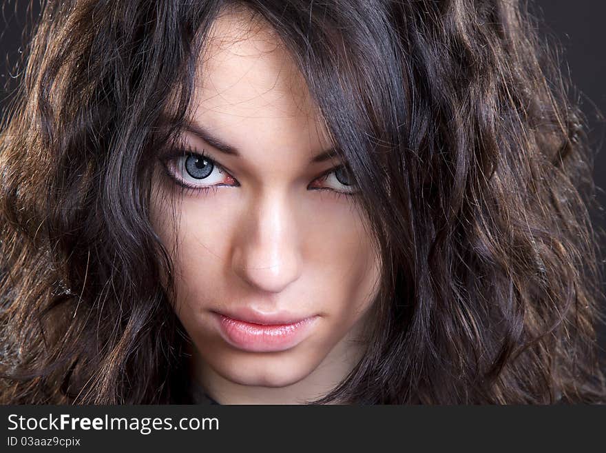 Black hair young caucasian charming woman portrait, studio shot. Black hair young caucasian charming woman portrait, studio shot