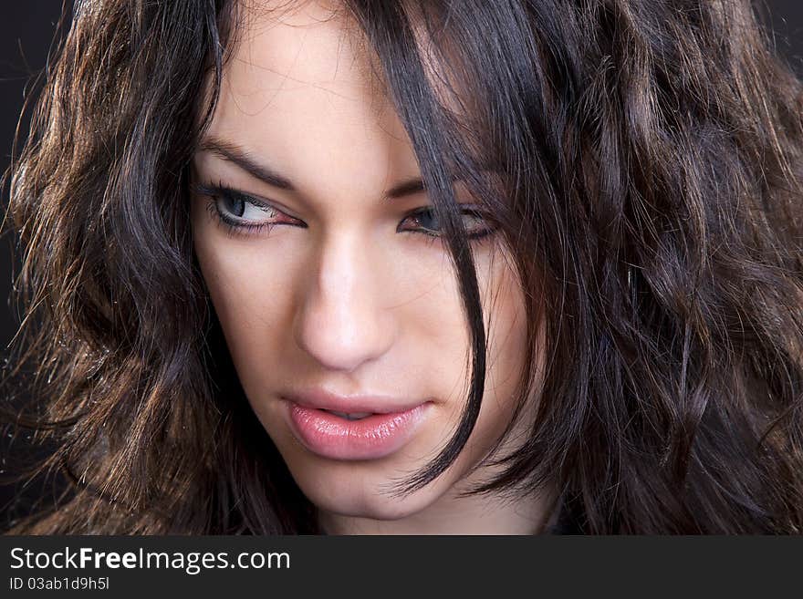 Black hair young caucasian charming woman portrait, studio shot. Black hair young caucasian charming woman portrait, studio shot