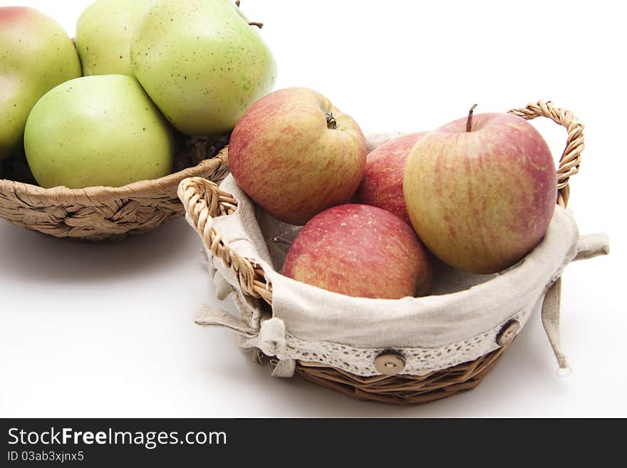 Greens and red apples in the basket