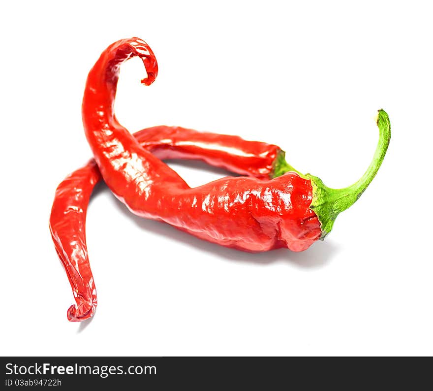 Red hot chili peppers on white background