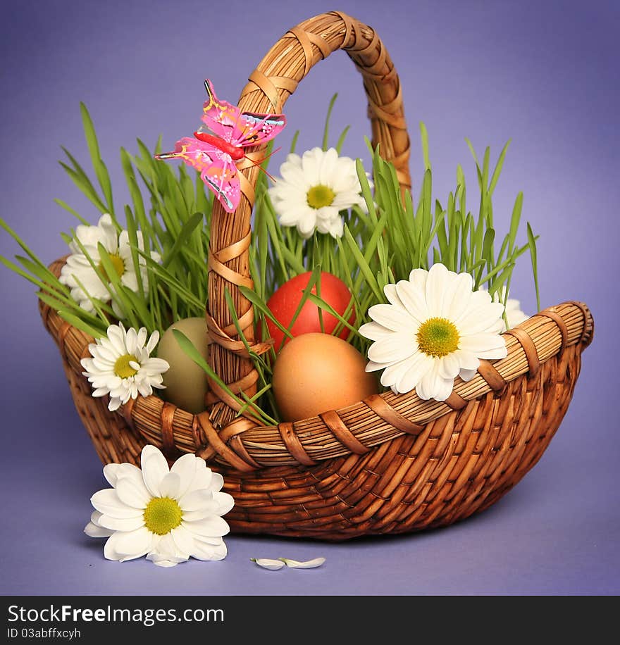 Basket with flowers on blue background. Basket with flowers on blue background