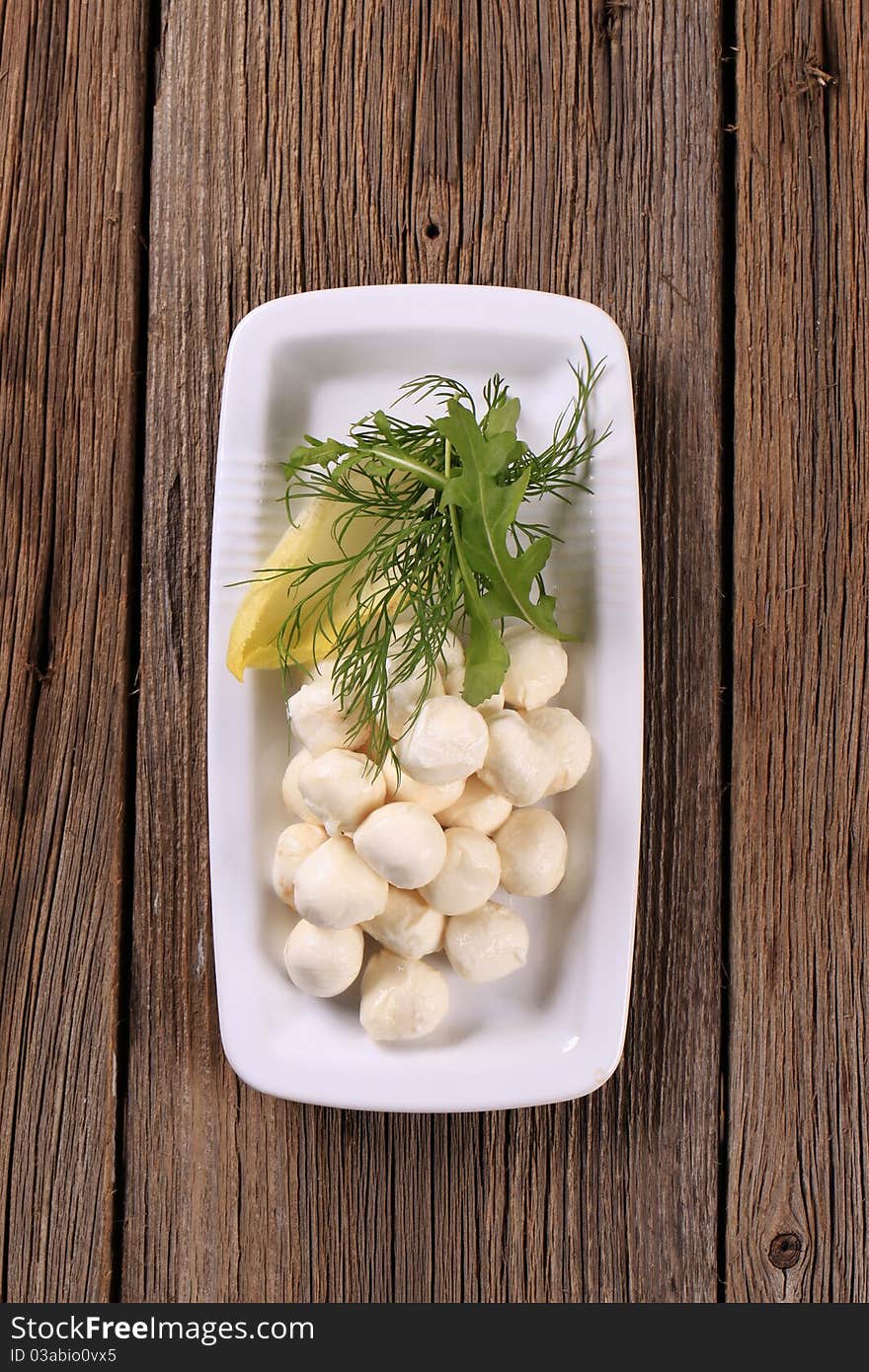 Fresh mozzarella cheese balls on a platter