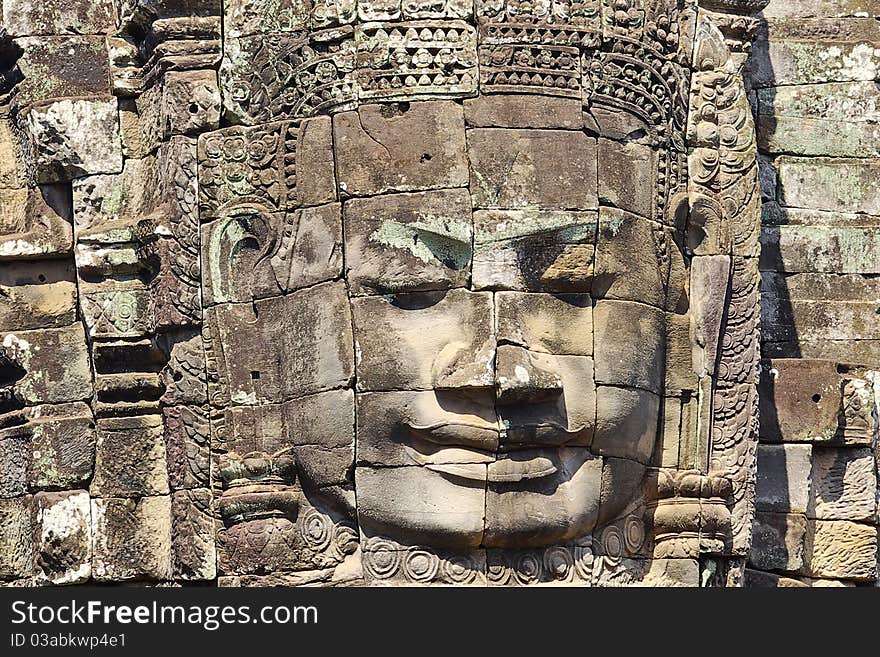 Stone head on towers of Bayon