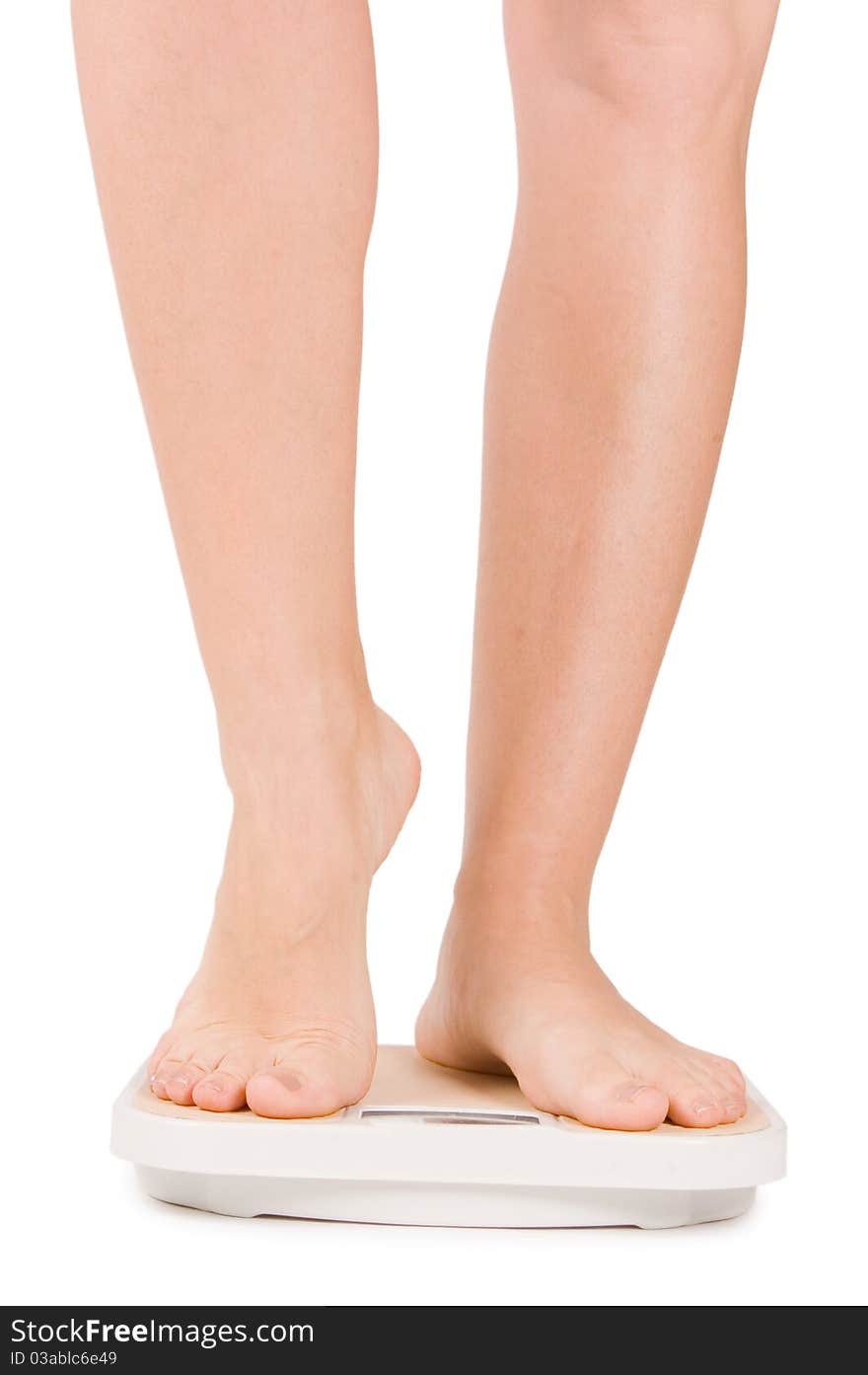 Female Feet On Scales Isolated