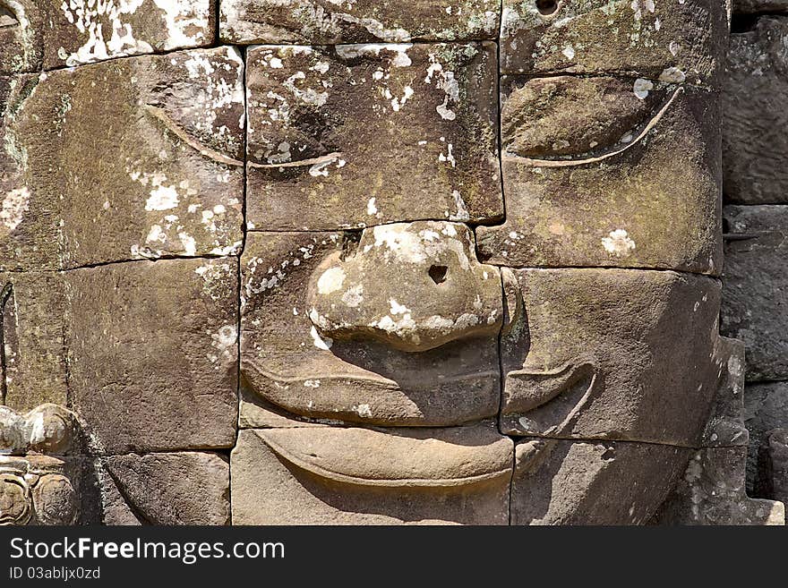 Stone head on towers of Bayon temple in Angkor Thom, Cambodia