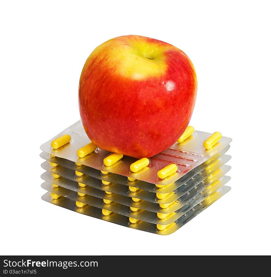 Red apple and pills isolated on the white background