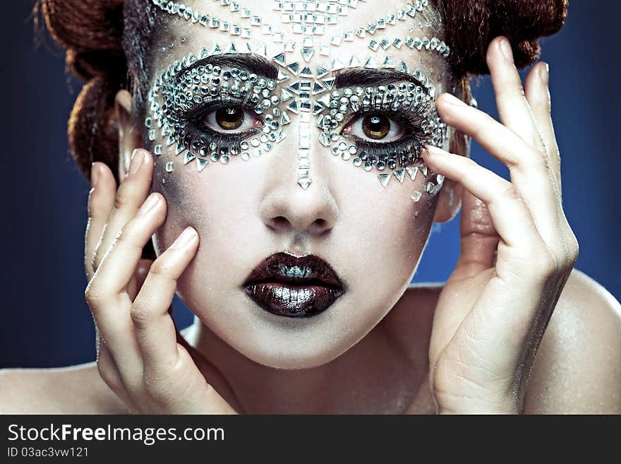 Beauty woman makeup with crystals on face