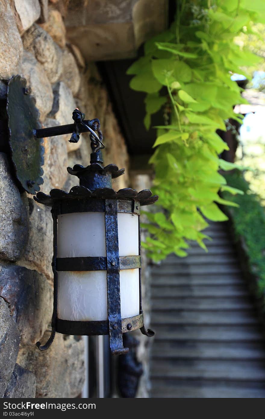 Lamp mounted on stone wall. Lamp mounted on stone wall