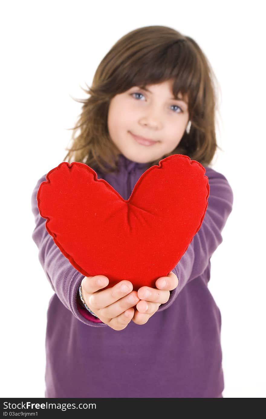 Happy little girl with red valentines heart - isolated