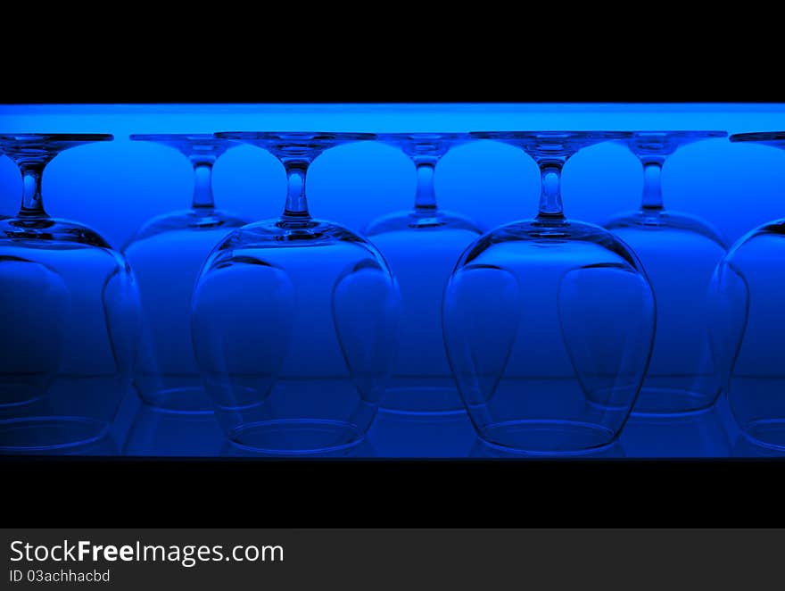 Glasses in the line lighted with background light