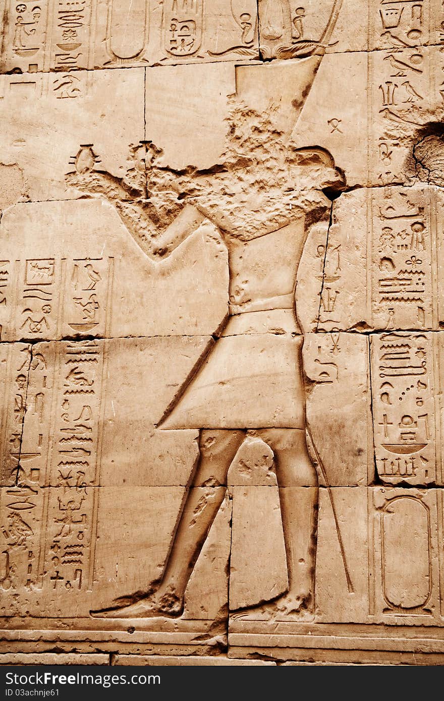 Egyptian images and hieroglyphs engraved on stone in Horus temple, Edfu, Egypt