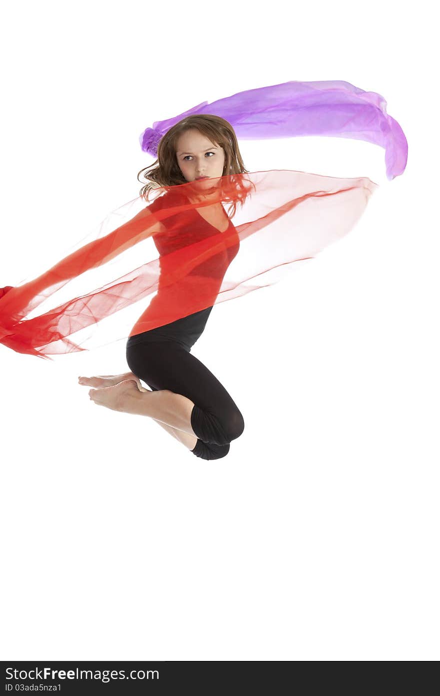 Young beautiful woman jumping with fabric.