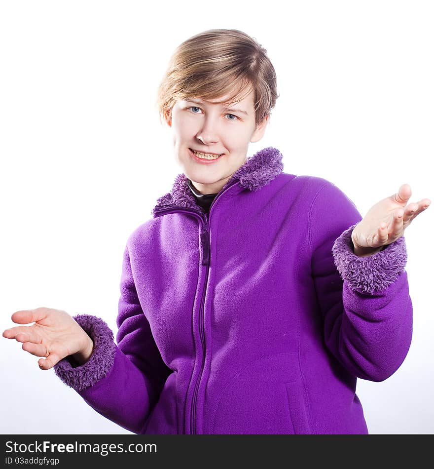 Young woman in a warm violet sweater, Shrugs shoulders