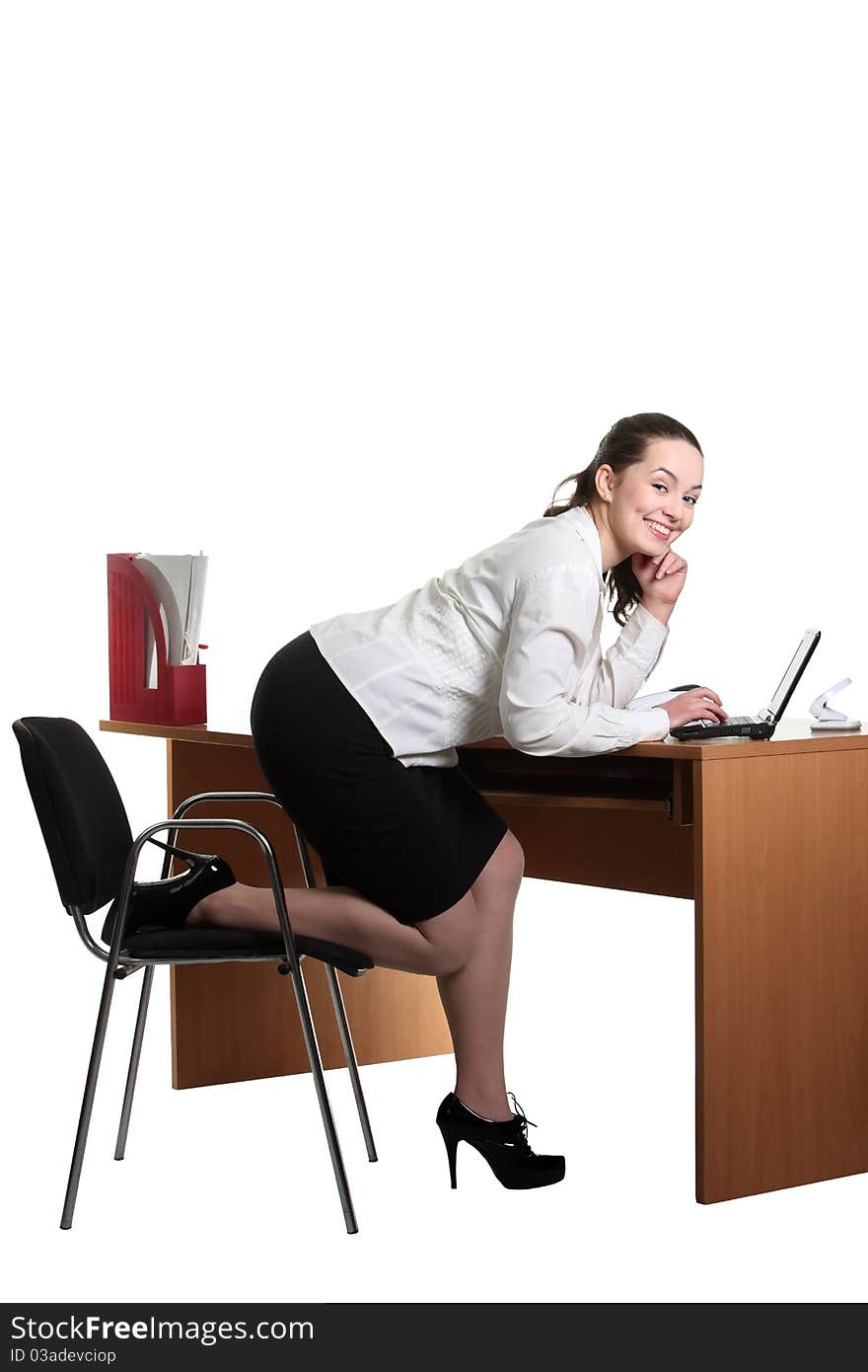 Young smiley businesswoman work on her laptop. Young smiley businesswoman work on her laptop