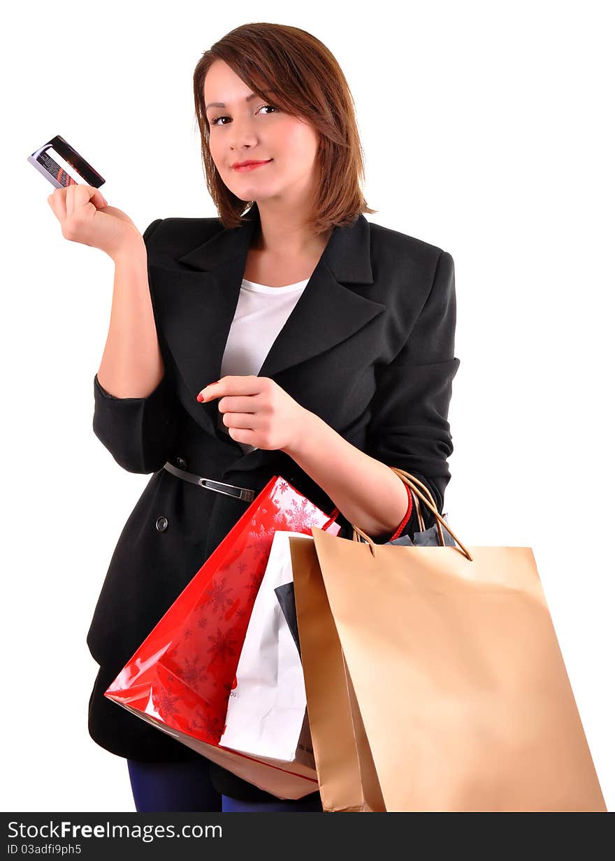 Portrait of stunning young woman carrying shopping bags against white background