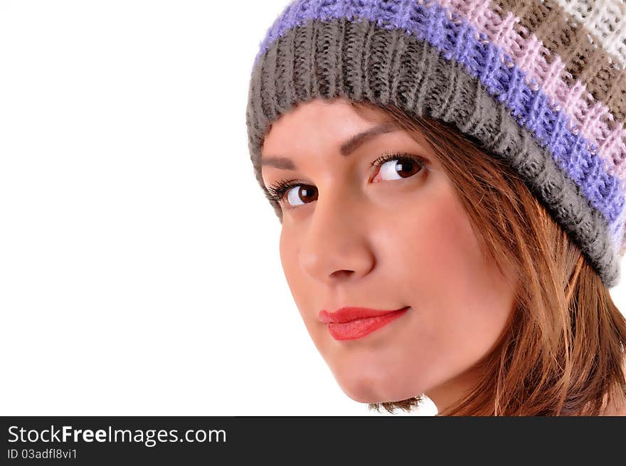 Close up of young woman with winter cap smiling isolated on white background