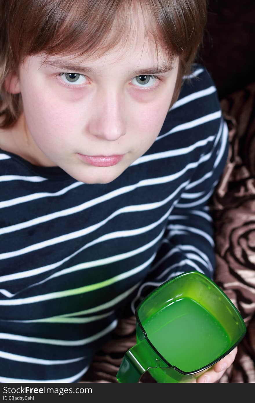 A teenager sitting on the stairs. A teenager sitting on the stairs.