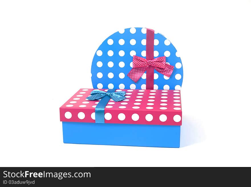 Two present decorated with dots and bows