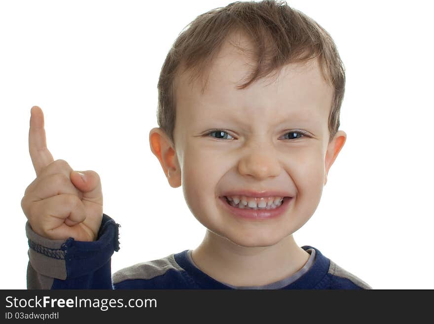 A little boy with blue eyes, threatening finger. Photos on a white background. A little boy with blue eyes, threatening finger. Photos on a white background.