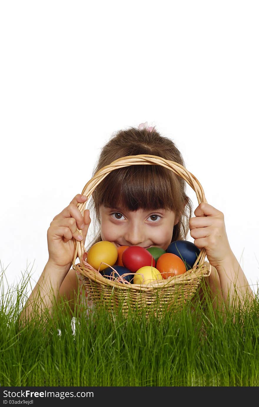 Girl keeping the basket with Easter painted eggs. Girl keeping the basket with Easter painted eggs