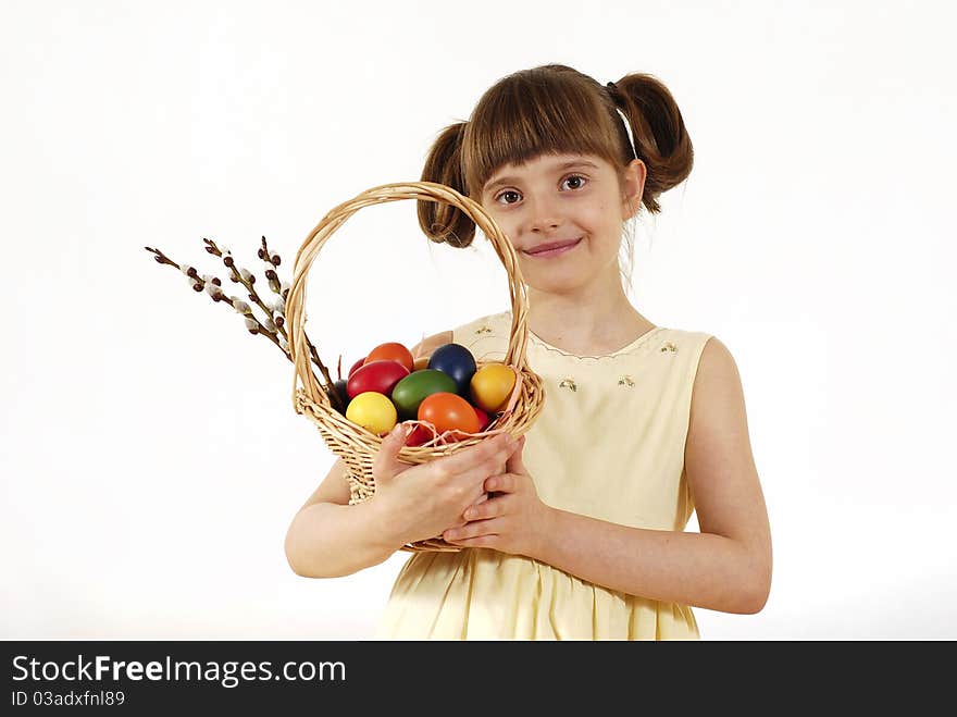 Girl keeping the basket with Easter painted eggs. Girl keeping the basket with Easter painted eggs