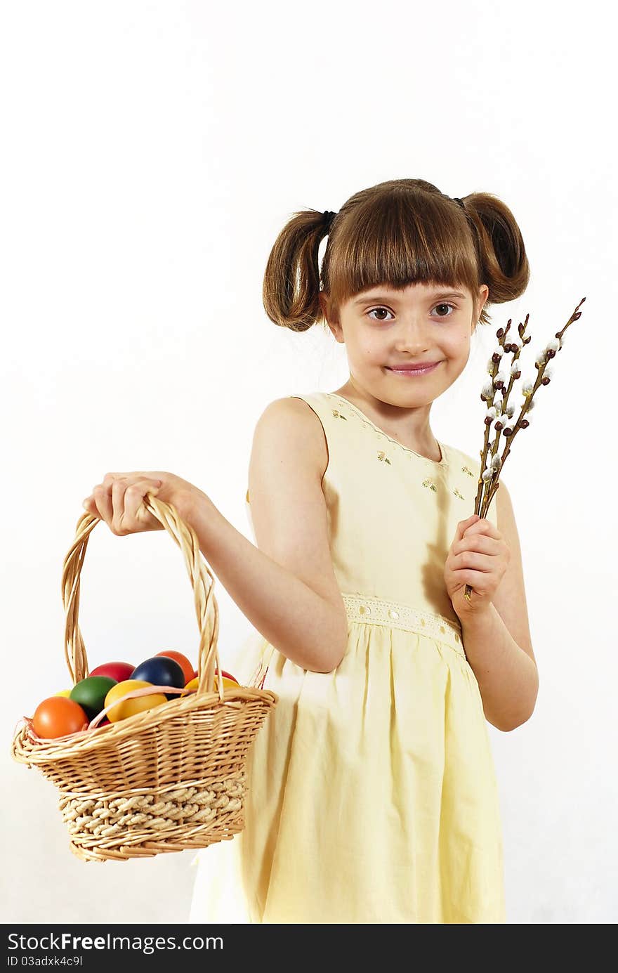 Girl keeping the basket with Easter painted eggs. Girl keeping the basket with Easter painted eggs